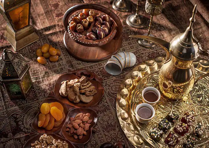 Dates and Arabic sweets arranged at a Dubai market stall