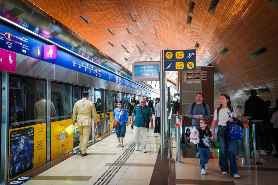 Tourists riding the Dubai Metro during a first visit to the city
