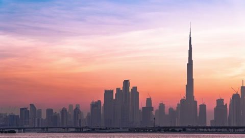 The Burj Khalifa rising above the Dubai skyline at sunset